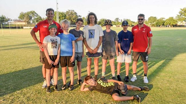 YOUNG GUNS: Sydney Swans players Joel Amartey (far left) and Will Hayward with junior Tigers. Picture: Tim Jarrett