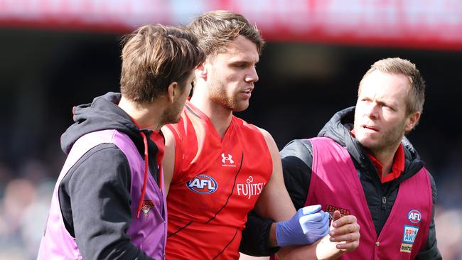 ADELAIDE, AUSTRALIA - MAY 07: Jordan Ridley of the Bombers taken from the ground with possible concussion during the 2023 AFL Round 08 match between the Port Adelaide Power and the Essendon Bombers at Adelaide Oval on May 7, 2023 in Adelaide, Australia. (Photo by Sarah Reed/AFL Photos via Getty Images)