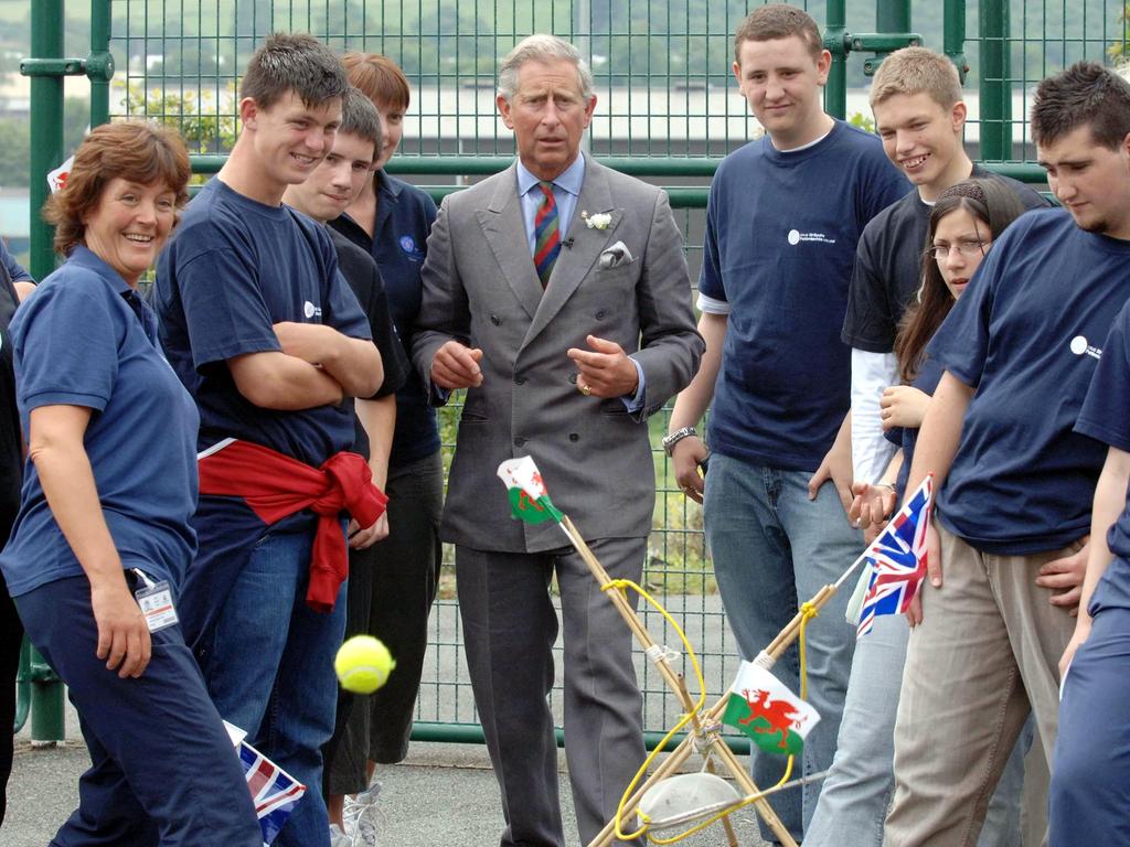 Prince Charles attempts a shot in a catapult game during a visit to the Prince's Trust Cymru Activity Centre at Pembroke Dock in Wales. Picture: Anwar Hussein Collection/ROTA/WireImage