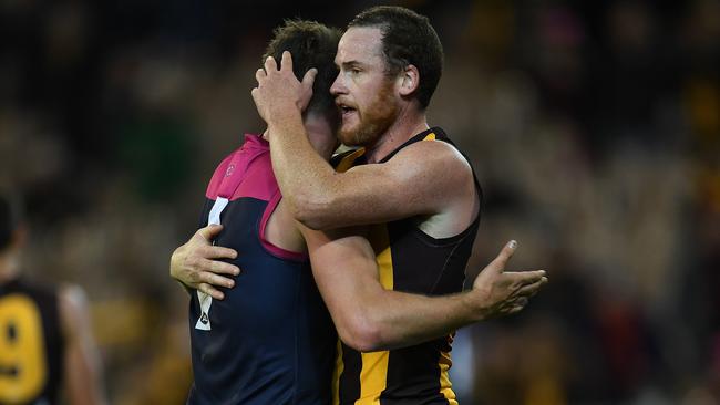 Jesse Hogan with Hawks skipper Jarryd Roughead after their round 7 clash. Roughead has endured his own cancer battle. Picture: AAP