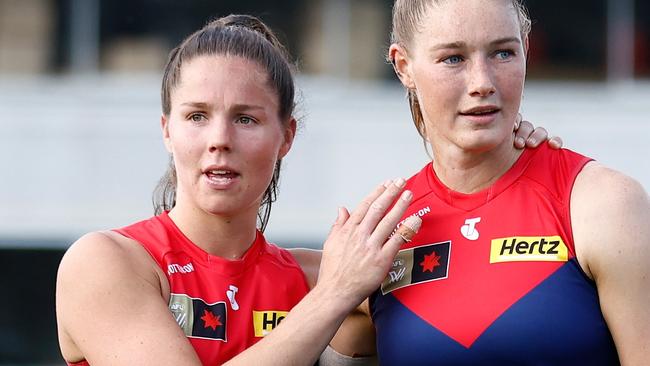 MELBOURNE, AUSTRALIA - NOVEMBER 12: Kate Hore (left) and Tayla Harris of the Demons look dejected after a loss during the 2023 AFLW Second Qualifying Final match between The Melbourne Demons and The North Melbourne Tasmanian Kangaroos at IKON Park on November 12, 2023 in Melbourne, Australia. (Photo by Michael Willson/AFL Photos via Getty Images)
