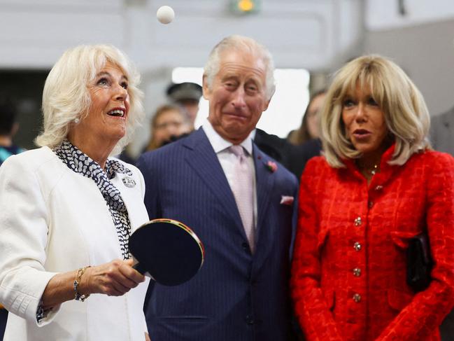 Queen Camilla plays table tennis next to King Charles III and French President Emmanuel Macron’s wife, Brigitte, during a state visit to Paris, home of the Rugby World Cup village, national stadium and venue for next year's Olympic Games. Picture: Hannah McKay/AFP