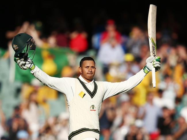 Usman Khawaja celebrates reaching his ton.
