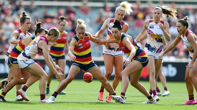 Erin Phillips and Rhiannon Metcalfe of the Crows compete with Greta Bodey of the Lions during the AFLW Grand Final this year. Picture: Mark Brake/Getty Images