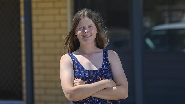 Apprentice electrician Hannah Greenfield outside the home she’s recently bought through HomeStart Finance at Salisbury North. Pic Roy Van Der Vegt