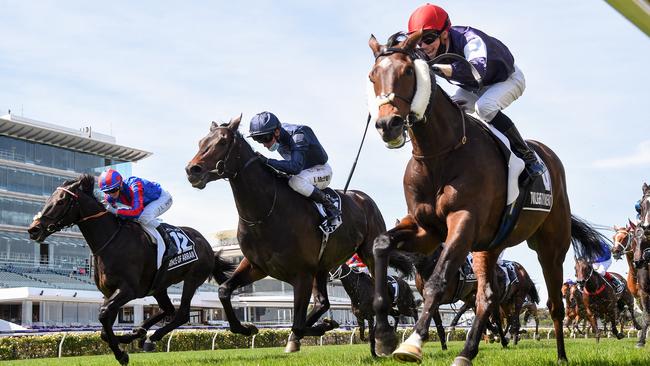 Twilight Payment, right, with Jye McNeil on board, holds off Tiger Moth, centre, and Prince of Arran to win the 160th Melbourne Cup on Tuesday. Picture: Getty Images