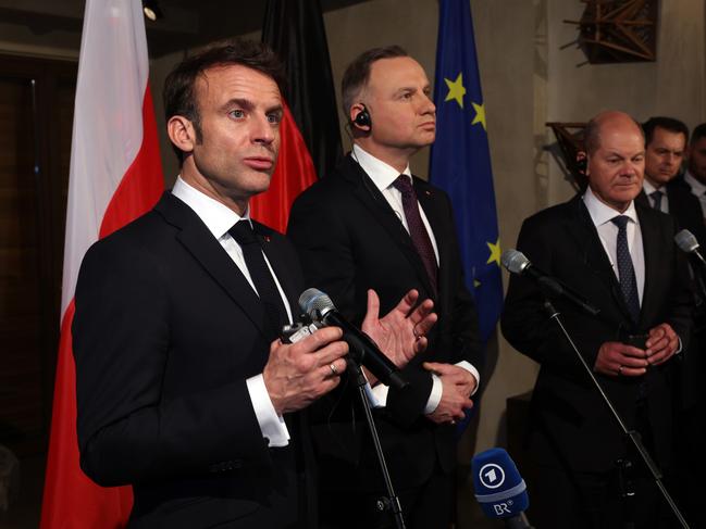 (L-R) French president Emanuel Macron, Polish President Andrzej Duda and German chancellor Olaf Scholz address the media at their bilateral meeting at the 2023 Munich Security Conference. Picture: Getty Images