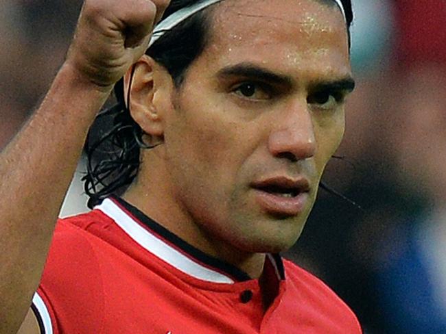 Manchester United's Colombian striker Radamel Falcao gestures to the crowd during the English Premier League football match between Manchester United and Queens Park Rangers at Old Trafford in Manchester, north west England on September 14, 2014. Manchester United won the game 4-0. AFP PHOTO/PAUL ELLIS RESTRICTED TO EDITORIAL USE. No use with unauthorized audio, video, data, fixture lists, club/league logos or “live” services. Online in-match use limited to 45 images, no video emulation. No use in betting, games or single club/league/player publications.