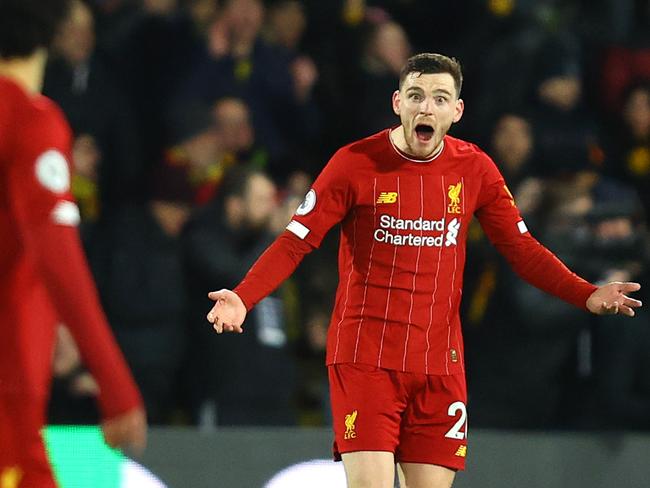 WATFORD, ENGLAND - FEBRUARY 29: Andy Robertson of Liverpool reacts towards teammate Mohamed Salah after conceding the third goal during the Premier League match between Watford FC and Liverpool FC at Vicarage Road on February 29, 2020 in Watford, United Kingdom. (Photo by Julian Finney/Getty Images)