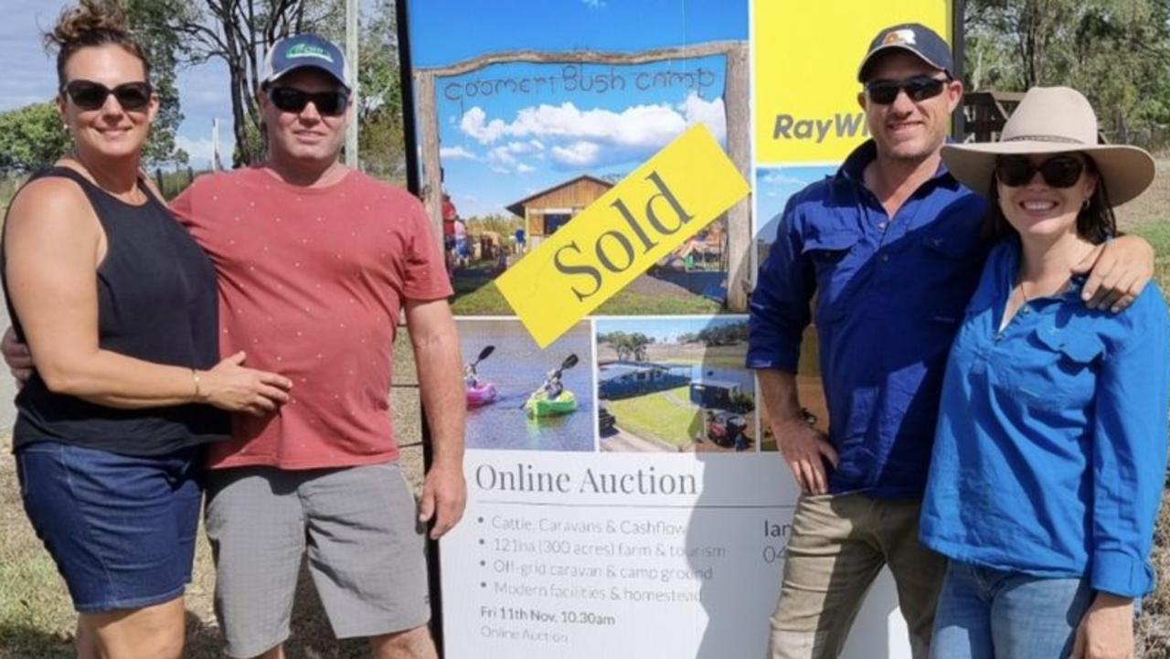 Erin and Shane O'Connell (former owners) stand with Cameron and Nicole Miller (new owners) of Goomeri Caravan and Bushcamp.