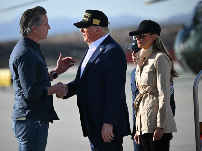 Mr Newsom was not on the list of attendees to a fire briefing arranged by the White House but turned up to greet the US President anyway. Picture: Mandel Ngan / AFP