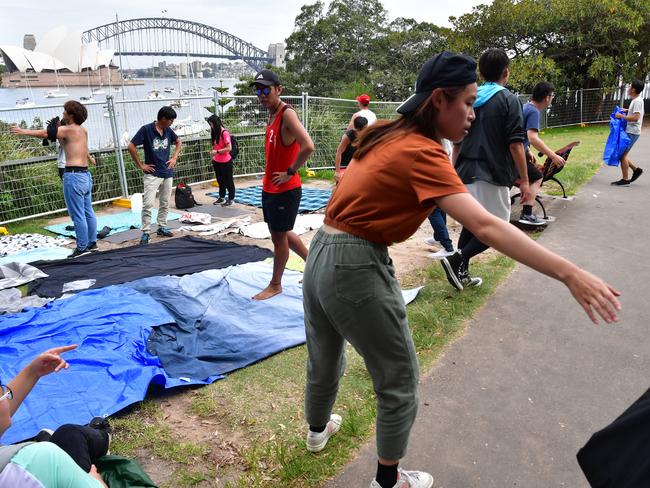 People are seen setting up at Mrs Macquarie's Point in preparation for New Years Eve Fireworks in Sydney, Monday, December 31, 2018. Picture: AAP / Brendan Esposito