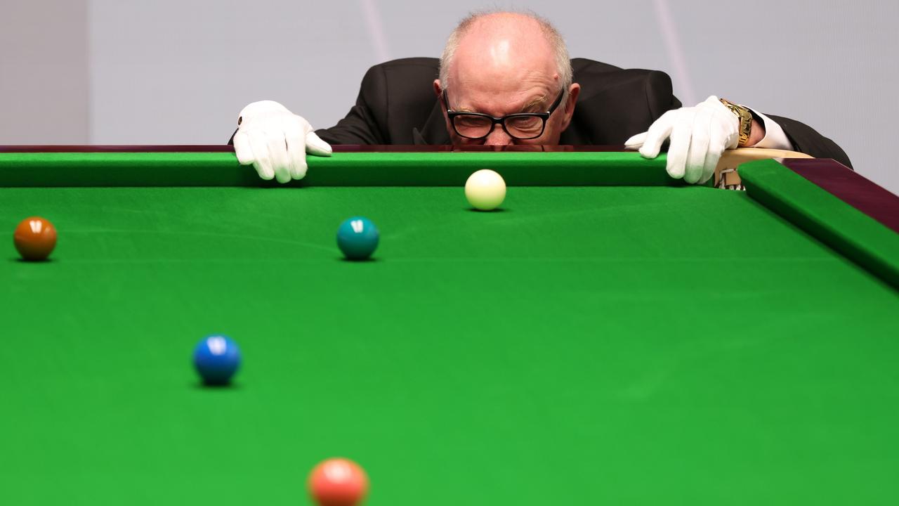 Referee Leo Scullion inspects the balls during a second-round match between Stuart Bingham and Jack Lisowski at the Cazoo World Snooker Championship 2024 in Sheffield, England. Picture: George Wood/Getty Images