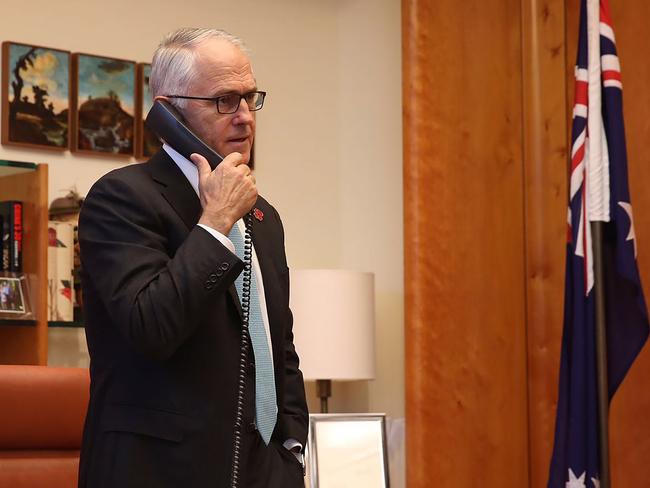 Malcolm Turnbull was pictured speaking to President elect Trump yesterday. Picture: AFP