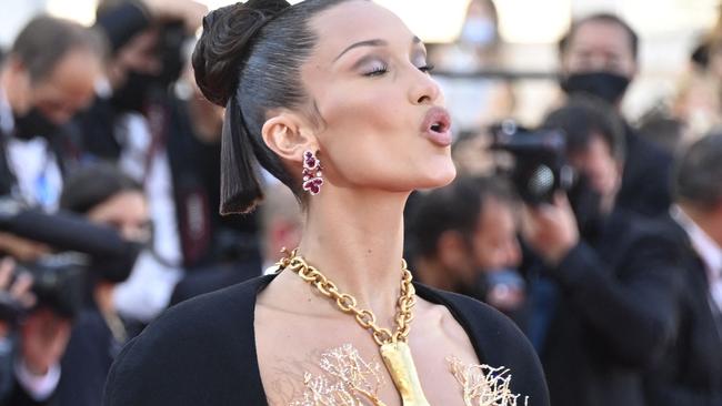 US model Bella Hadid poses as she arrives for the screening of the film "Tre Piani" (Three Floors) at the 74th edition of the Cannes Film Festival in Cannes, southern France, on July 11, 2021. (Photo by John MACDOUGALL / AFP)