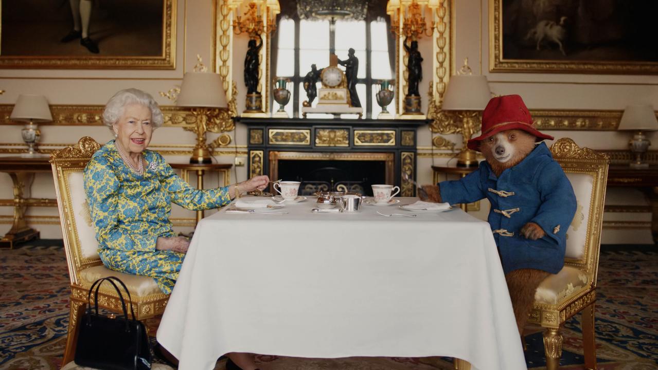 Footage of Queen Elizabeth II and Paddington Bear having cream tea at Buckingham Palace. Picture: Buckingham Palace/Studio Canal/BBC Studios/Heyday Films via Getty Images