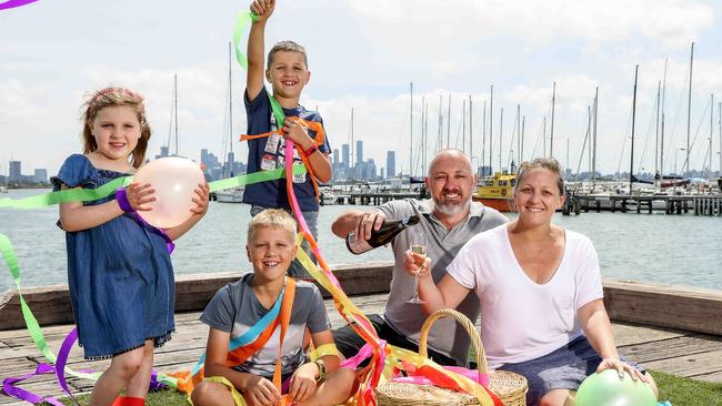 Amy and Justin Chrimes with their children Ela, Oli and Lachie get ready to wave goodbye to 2020. Picture: Ian Currie