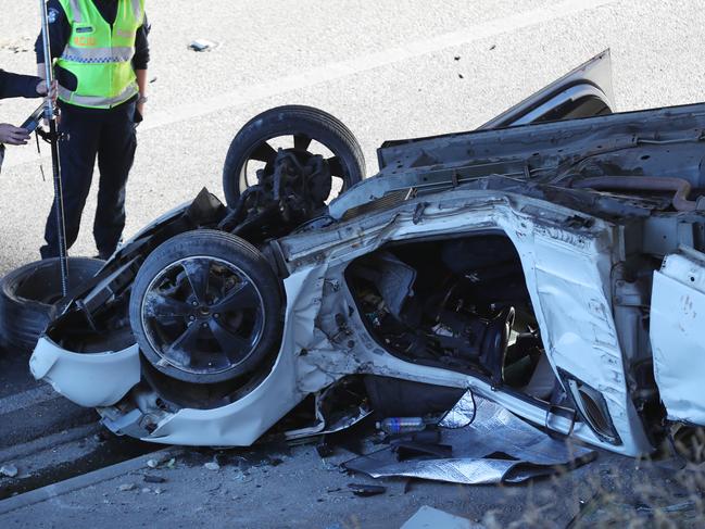 Police at the scene on the Monash fwy closed after a Ute has crashed after allegedly racing with another car that did not stop. Tuesday, December 29, 2020. Picture: David Crosling