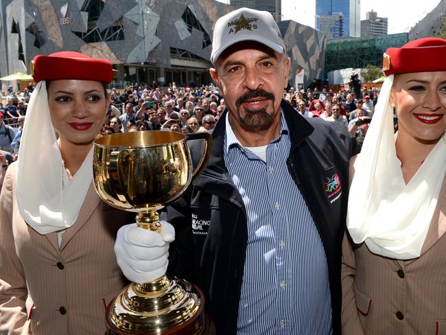 Melbourne cup press conference featuring 2013 Emirates Melbourne Cup trainers and jockeys. A very confident  Dr Marwan Koukash owner of Mount Athos holds the Cup after the Press conference.