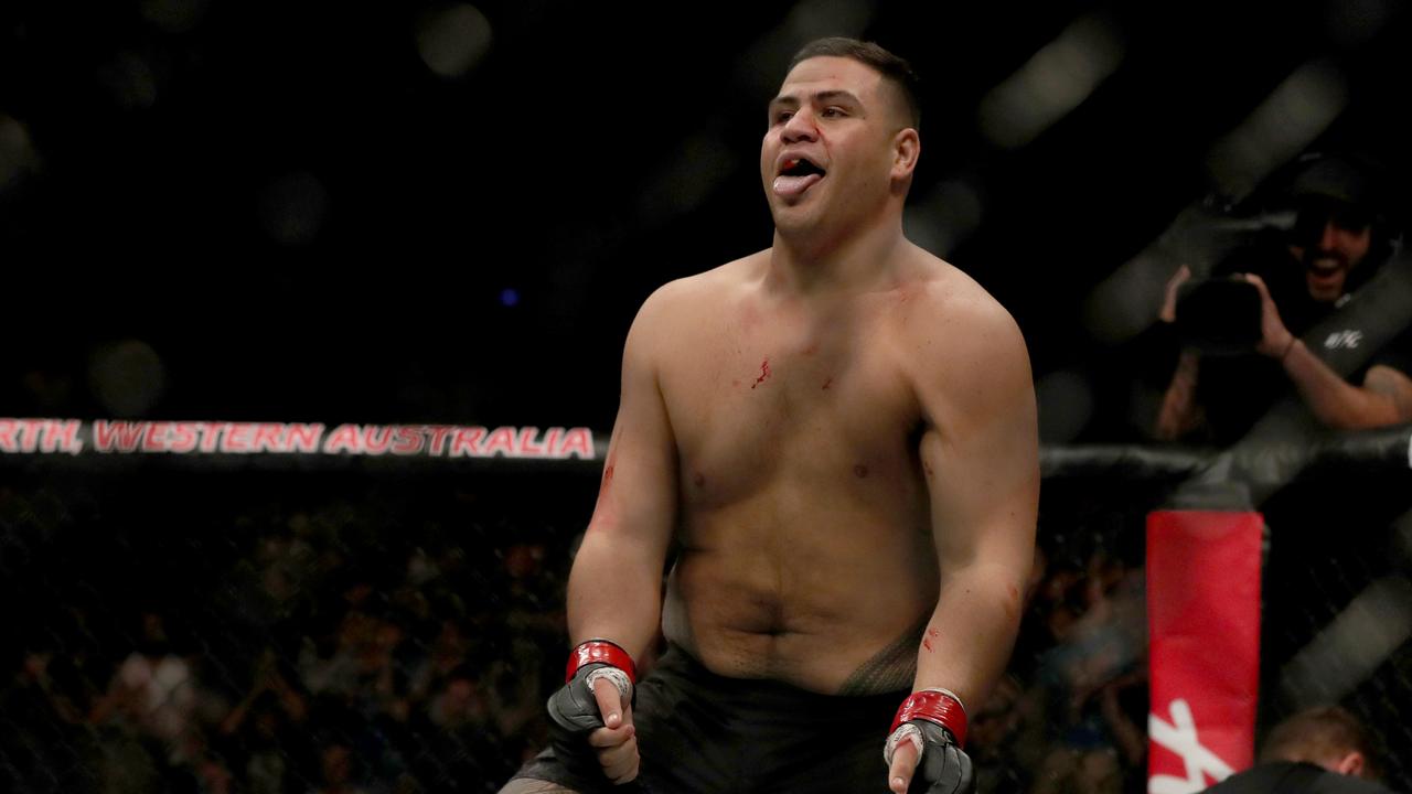 Tai Tuivasa from Australia celebrates winning. AAP Image/Richard Wainwright.