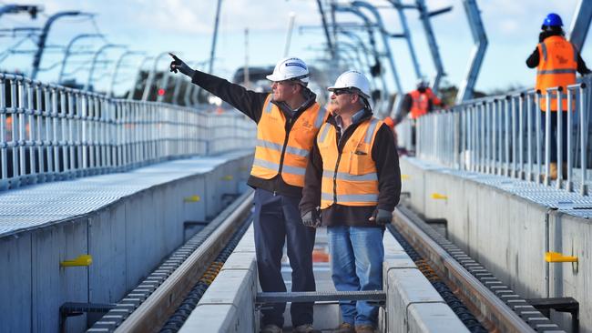 Simon Barnes and Adrian Guest check out the track at the new Murrumbeena station. Picture: Tony Gough