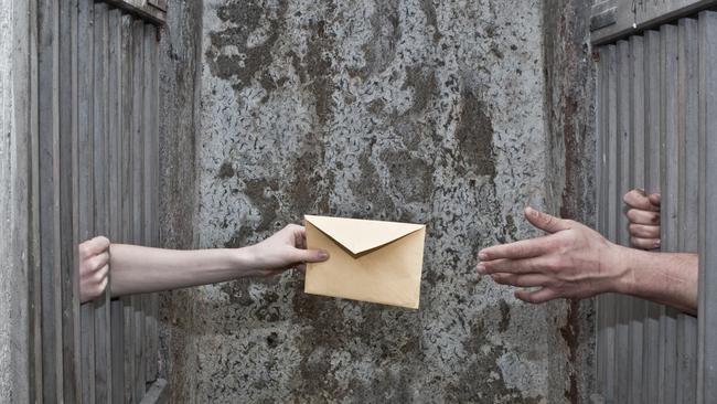 Two alleged scammers have used their court appearance as an opportunity to flirt with each other by flashing love notes from custody. Picture: Supplied.