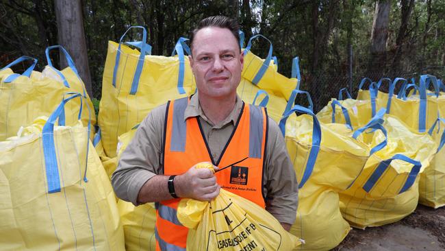 Lord Mayor Adrian Schrinner with sandbags last year at the council’s Lota depot. He is warning 20,000 residents could be at risk of flooding. Picture: Liam Kidston