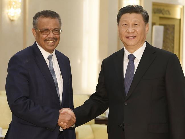 World Health Organisation director general Tedros Adhanom shakes hands with Chinese President Xi Jinping nearly a year ago. Picture: AFP