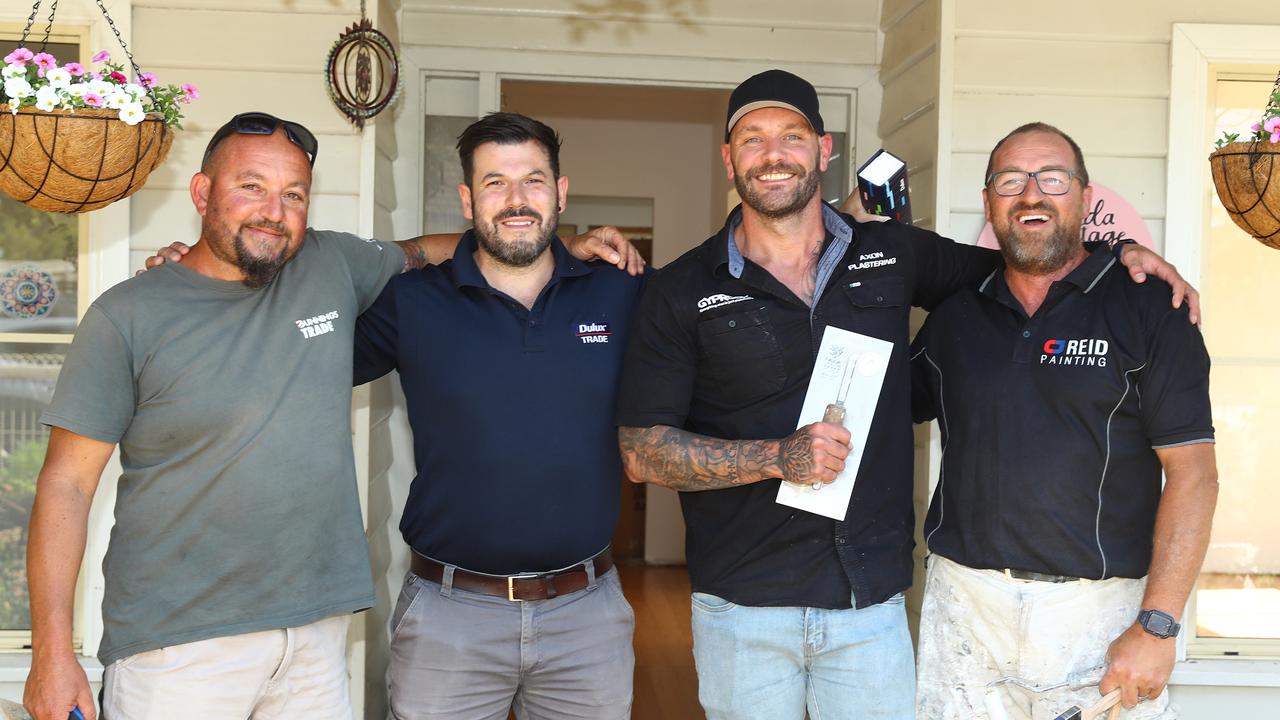 The tradies who helped rebuild the Bridge house for free. From left: Charlie Debono from Charlie’s Mowing and Maintenance, Dulux Trade’s Geelong territory manager Mus Erkul, director of Axon Plastering Anthony Axon, and Colin Reid, owner of CJ Reid Painting. Picture: Alison Wynd.