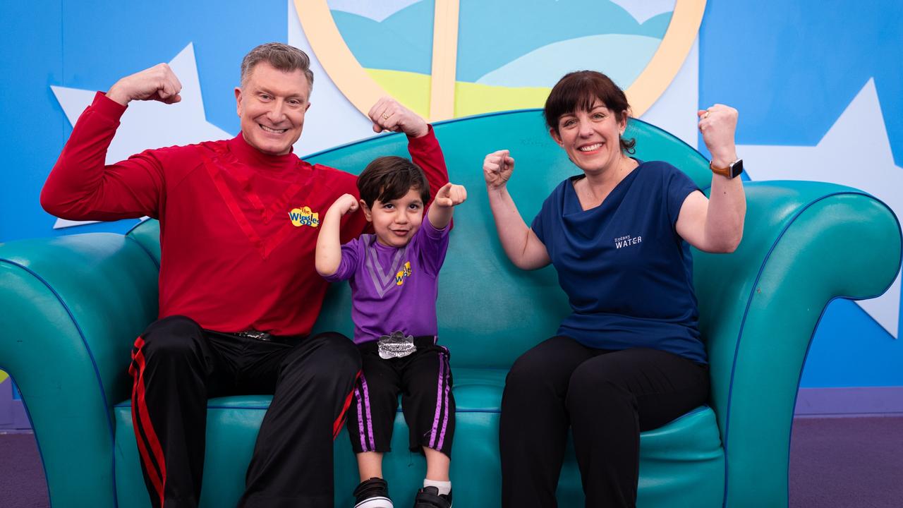 Red Wiggle Simon with Leo Mikhael, 4, and Tracey Willingham from Sydney Water. Picture: Supplied