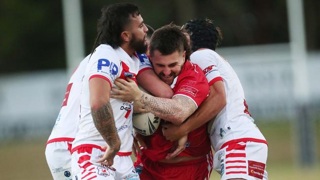 Kincumber’s Curtis Naughton held by the Woy Woy defence. Picture: Sue Graham