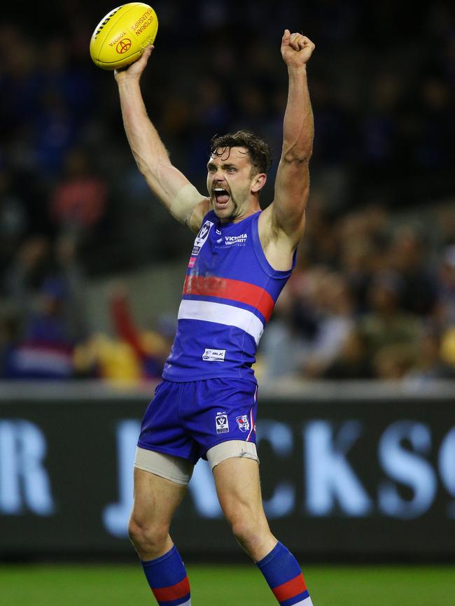 You ripper!: Bundy Barry celebrates a Doggies flag. Picture: Michael Dodge.