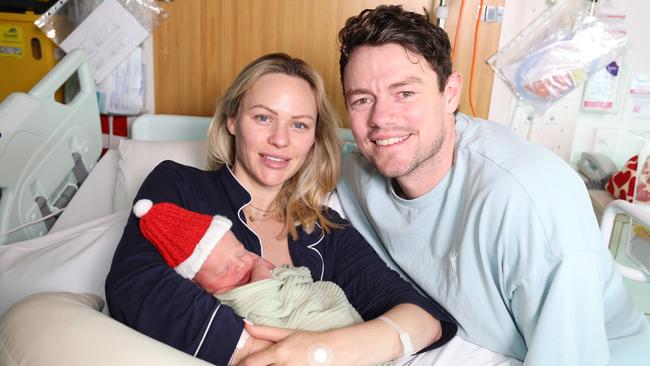 Lachie Neale with his new baby son Freddie and wife Julie. Picture: Annette Dew