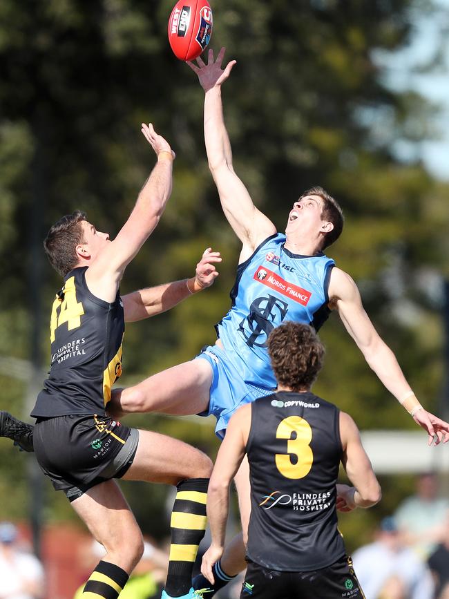 Sturt VFL recruit Darcy Bennett leaps high against Glenelg’s Jack Hannath. Picture: SARAH REED.