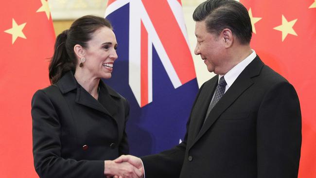 China's President Xi Jinping (R) shakes hands with New Zealand's Prime Minister Jacinda Ardern: Ardern took a softly softy approach to China.