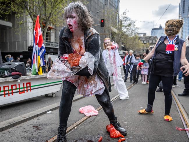 Most protesters wore masks or costumes. Picture: Jake Nowakowski