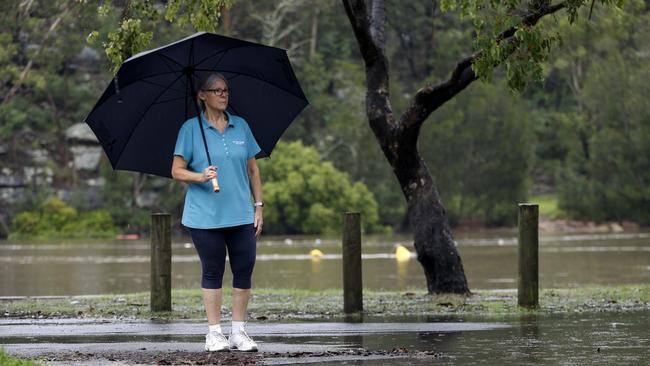 Wendy Gurney at the end of her driveway on Corinya Road Picnic Point. Picture: John Appleyard