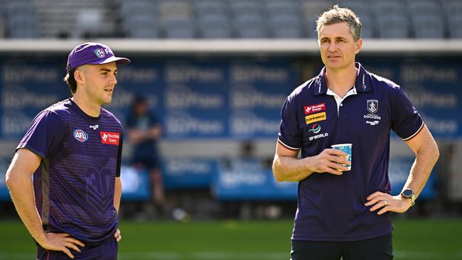 Jordan Clark chats with Dockers coach Justin Longmuir. Picture: Daniel Carson/AFL Photos via Getty Images