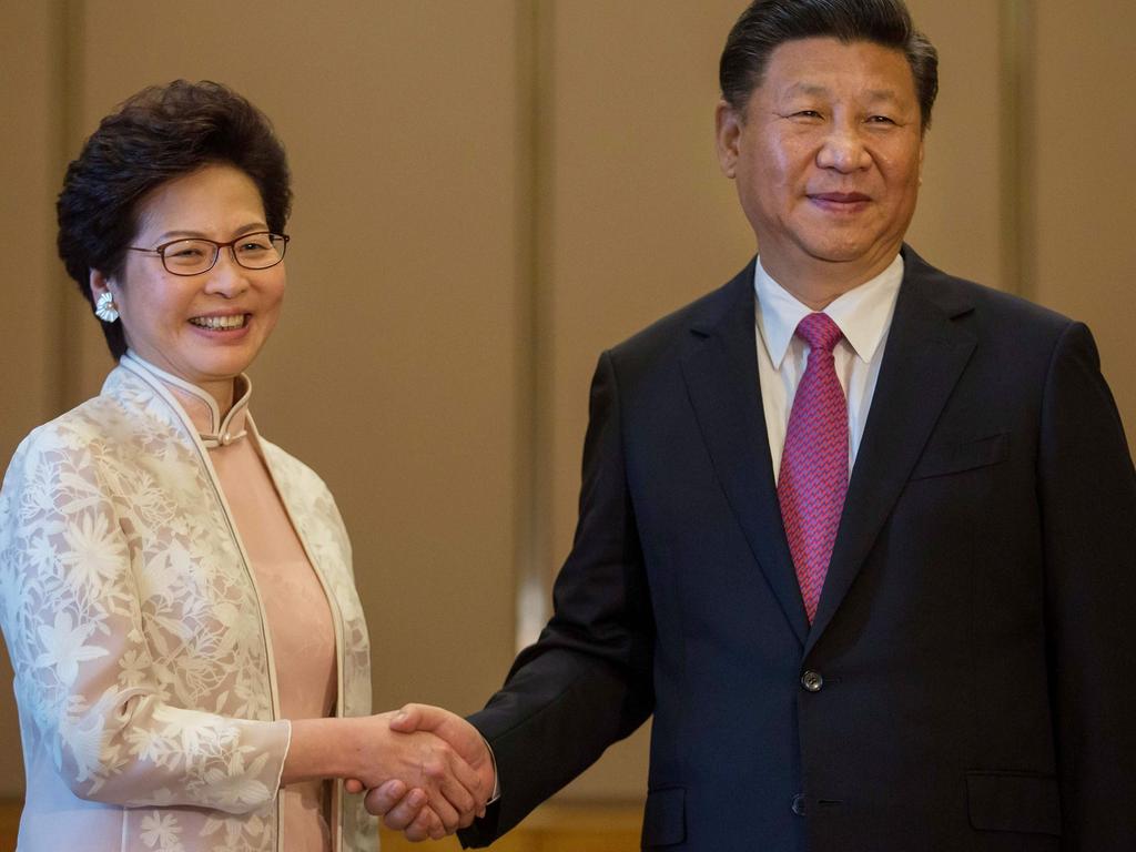 Ms Lam, pictured with China’s President Xi Jinping, insisted Beijing had nothing to do with the proposal and it was down to ‘our clear conscience, and our commitment to Hong Kong’. Picture: AFP / Pool / Billy H.C. Kwok