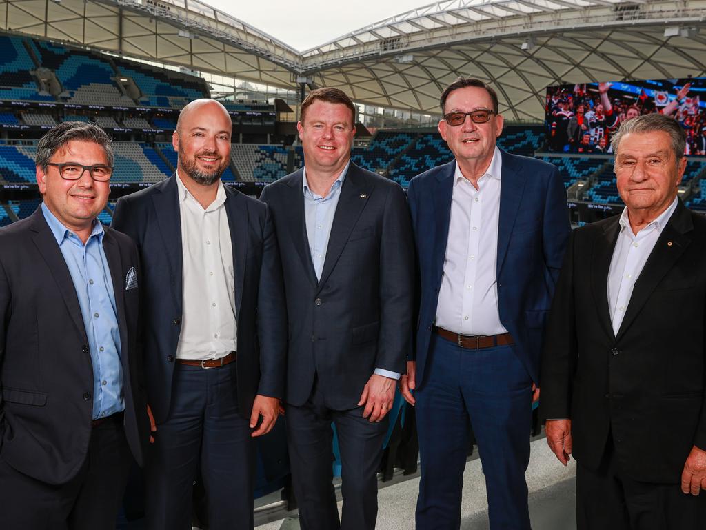 NRL clubs will receive $68 million over the next four years in return for welcoming PNG into the premiership. Pictured (L-R) is Sharks CEO Dino Mezzatesta, Eels CEO Jim Sarantinos, Rabbitohs CEO Blake Solly, Panthers CEO Brian Fletcher and Roosters Chairman Nick Politis. Picture: Justin Lloyd.