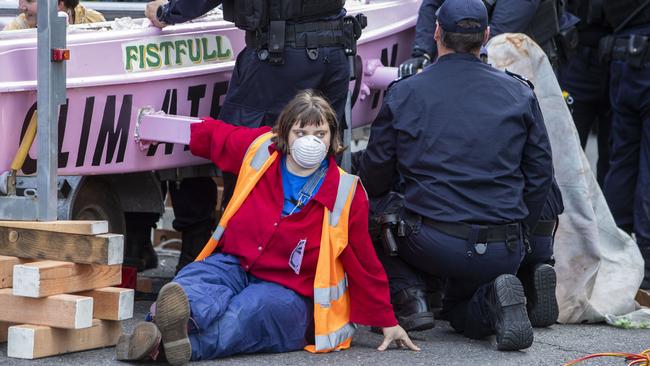 Activists attached to a catamaran in Brisbane’s CBD. Picture; AAP.