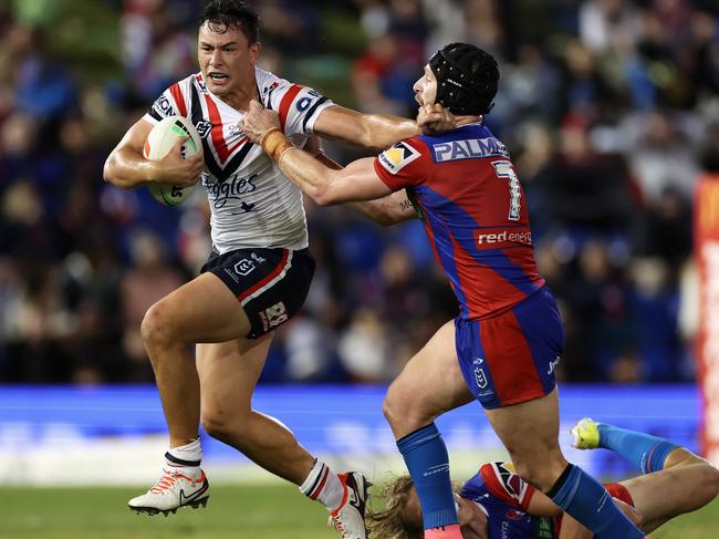 NEWCASTLE, AUSTRALIA - APRIL 11: JosephÃÂ Manu of the Roosters is tackled during the round six NRL match between Newcastle Knights and Sydney Roosters at McDonald Jones Stadium, on April 11, 2024, in Newcastle, Australia. (Photo by Cameron Spencer/Getty Images)