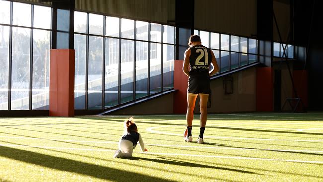 Carlton's Jack Martin with daughter Rosie crawling after him. Picture: Dylan Burns/AFL Photos.