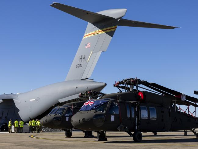 Two Australian Army UH-60M Black Hawk helicopters are unloaded from a United States Air Force C17 Globemaster III, at RAAF Base Richmond, Sydney. *** Local Caption *** In early 2023, Defence announced the decision to acquire 40 UH-60M Black Hawk helicopters for the Australian Army through a Foreign Military Sales case with the United States. Australia continues to receive extraordinary levels of support from the United States Government and Army to deliver the Black Hawk capability. 12 aircraft are scheduled to be delivered to Australia by the end of this year. All 40 aircraft are scheduled for delivery by 2029. The UH-60M Black Hawk fleet will be based out of Oakey, Queensland and Holsworthy, New South Wales.