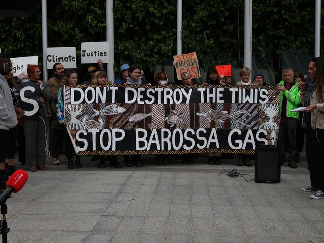MELBOURNE, AUSTRALIA - NOVEMBER 15: Protesters hold a banner at the front of the Federal Court Of Australia on November 15, 2022 in Melbourne, Australia. The Federal Court is hearing an appeal by Santos Ltd., which seeks to restart drilling in the Barossa Gas project, located near the Tiwi Islands off the northern coast of Australia. Courts had earlier ruled the approval for drilling in the project as invalid. (Photo by Tamati Smith/Getty Images)