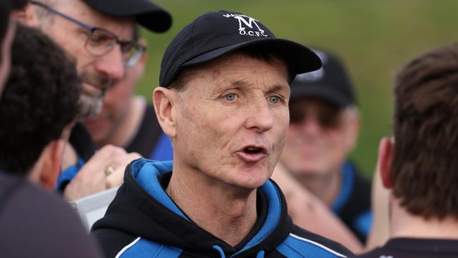 Mazenod coach Peter Banfield addressing his players on Saturday. Photo: Hamish Blair