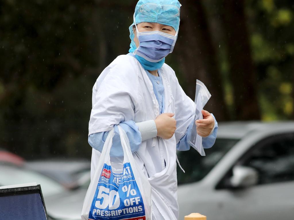 A hospital worker walks out of a COVID testing clinic across the road from the Concord Repatriation General Hospital. Picture: NCA NewsWire/Damian Shaw