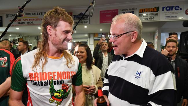 Prime Minister Scott Morrison meets with "club legend" Jarrad Cirkel also known as J.Rod at the Bridgenorth Football Club in Launceston. (AAP Image/Mick Tsikas)