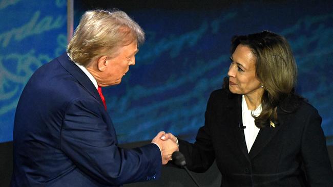 Former US President and Republican presidential candidate Donald Trump shakes hands with US Vice President and Democratic presidential candidate Kamala Harris before their presidential debate in September. Picture: Saul Loeb/AFP