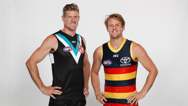 Port captain Tom Jonas and Crows skipper Rory Sloane. Picture: Dylan Burns/AFL Photos